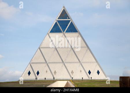 he Palace of Peace and Reconciliation, also translated as the Pyramid of Peace and Accord. The palace is located in the green Presidential Park. Stock Photo
