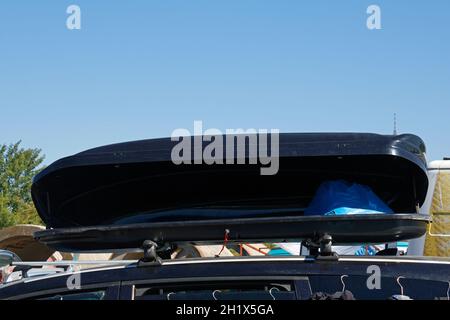 Roof top cargo box on car full with stuff for family vacation Stock Photo
