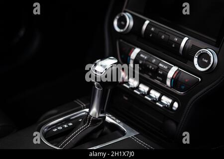 DIEDERSDORF, GERMANY - AUGUST 21, 2021: The details of interior of sports car Ford Mustang (sixth generation), close-up. Focus on the foreground. The Stock Photo