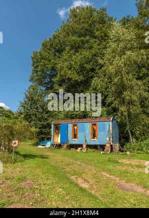 Old construction trailer converted into a caravan Stock Photo