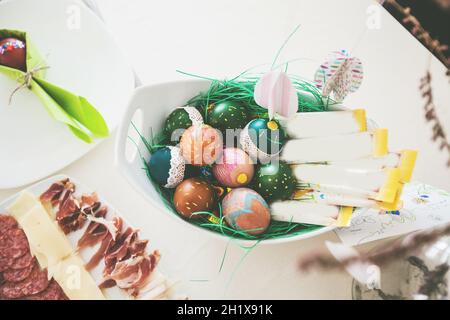Easter eggs , traditional colorful eggs, Symbol of Eastern Orthodox Easter Day, table setting at home Stock Photo