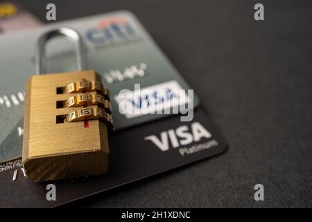 Bangkok, Thailand - July 1, 2020 Golden security digital password lock key on visa master card background. Stock Photo