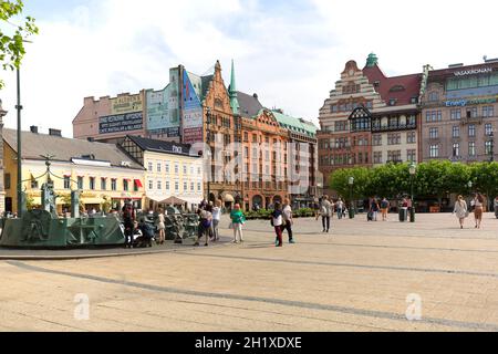 Malmo, Sweden - June 24, 2019: Stortorget, Great Square, historical buildings and walking people Stock Photo