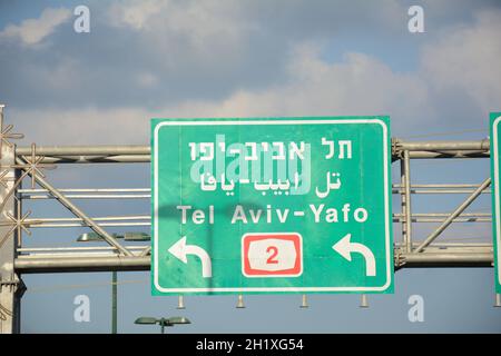 Traffic (Road) sign to Tel Aviv. Tel Aviv to Haifa, Highway 2 in Israel. Trilingual road sign in Israel Stock Photo