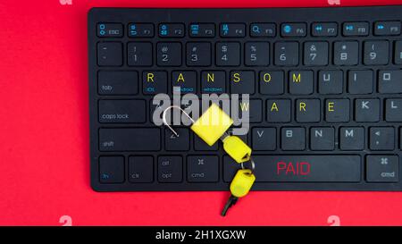 Computer security and extortion concept. Ransomware virus has encrypted data in laptop. Hacker is offering key to unlock encrypted data for money. Stock Photo