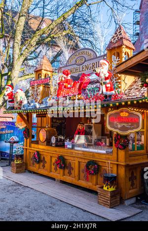 Basel, Switzerland - December 2017. GlueBasler Weihnachts Markt and mulled wine wooden house in Munsterplatz. Stock Photo