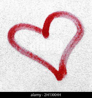 Red heart hand drawn on concrete wall. Concept or conceptual painted red abstract heart shape love symbol, dirty wall background, metaphor to urban an Stock Photo