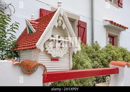 Fancy letter box in Basque style and colours, seen in the former fishing village of Bidart, southern France Stock Photo