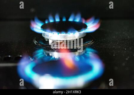A lit gas ring on a cooker, Cumbria, UK. Stock Photo
