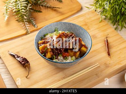 Stir fried tofu with spicy sauce served with rice Stock Photo