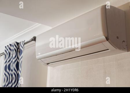 Wall domestic air conditioner, internal part of split-system in room interior at home Stock Photo
