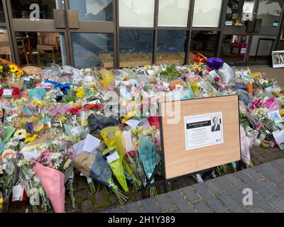 A sign placed next to the floral tributes left outside the Belfairs Methodist Church in Leigh-on-Sea, Essex, where Conservative MP Sir David Amess was killed on Friday. Picture date: Tuesday October 19, 2021. Stock Photo