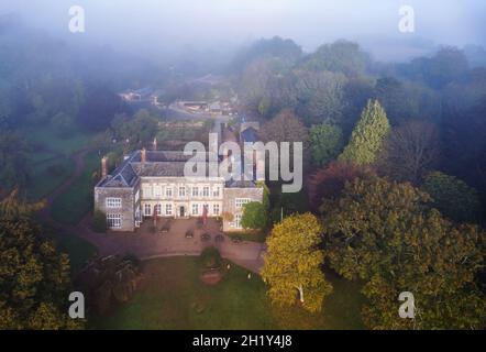 Foggy view for Cockington Court from a drone, Torquay, Devon, England, Europe Stock Photo