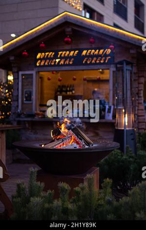 fireplace at traditional christmas market (Christkindlmarkt) at Hotel Terme Meran (Merano, South Tyrol  Italy) Stock Photo