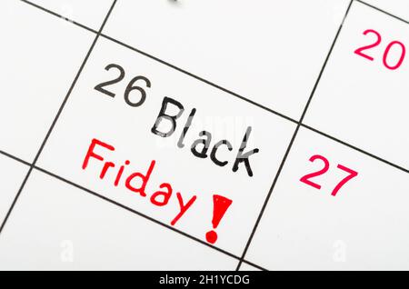 Handwritten Black Friday event day marked on a white calendar. Stock Photo