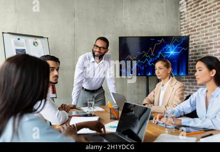 Business Training. Diverse Multiethnic Colleagues Having Conference Meeting In Boardroom Stock Photo