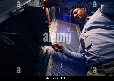 IT professional focused on replacing blade server Stock Photo