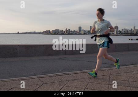 Young man jogging along the beach front,Montevideo,Uruguay,South America Stock Photo