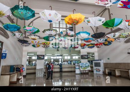 Umbrellas hanging from the ceiling of the post office in San Jose, Costa Rica. Stock Photo