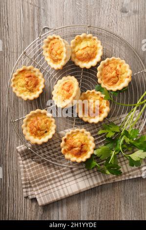 Spicy mini quiche on a cooling rack Stock Photo