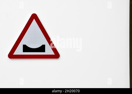 Warning sign for speed bumps, on white background. Stock Photo