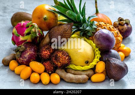 Exotic fruits on a concrete background Stock Photo