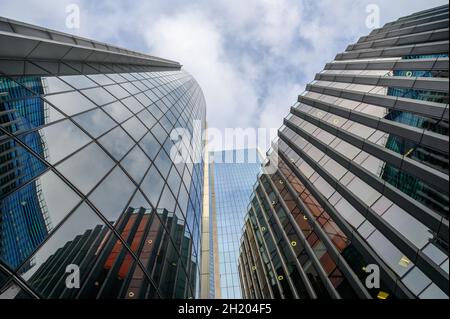 Looking skywards between the buildings of Willis Towers Watson, 25 Fenchurch Avenue and The Scalpel in City of London, England. Stock Photo