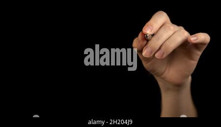 Hand writing on empty copy space black background. Woman hand with pen marking checklist concept with copy space Stock Photo