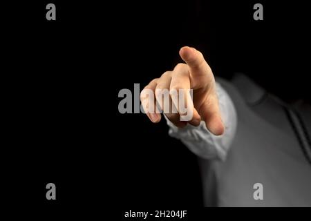 You are fired concept, boss gesturing way out hand sign and symbol with index finger on a black background Stock Photo