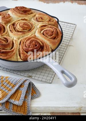 Danish cinnamon rolls in an enamel pan Stock Photo
