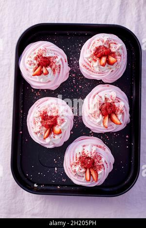 Meringues with strawberries Stock Photo
