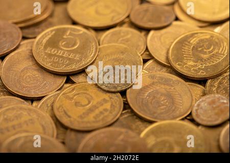 Old coins out of circulation in bulk, background image, close-up, selective focus Stock Photo