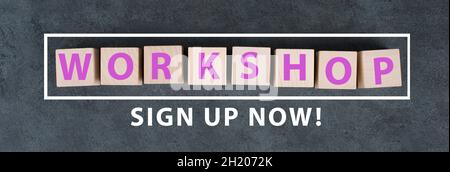 The word workshop is standing on wooden cubes, sign up now bottom Stock Photo