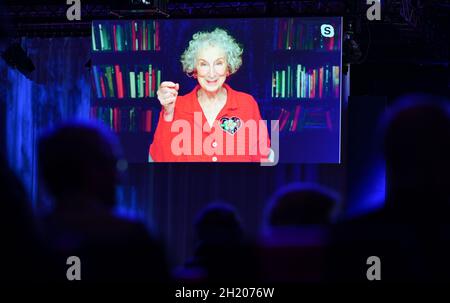 19 October 2021, Hessen, Frankfurt/Main: Margaret Atwood, writer from Canada, is live during the opening ceremony of the Frankfurt Book Fair in the Festhalle. This year's Guest of Honour is Canada. Photo: Arne Dedert/dpa Stock Photo