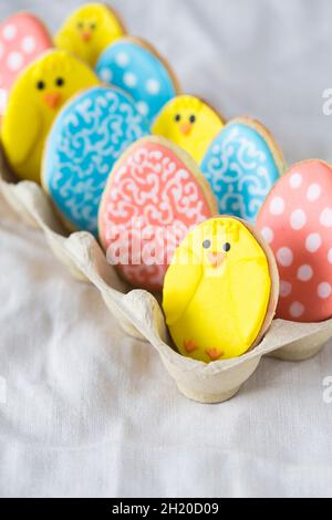 Colourful Easter biscuits in an egg box Stock Photo
