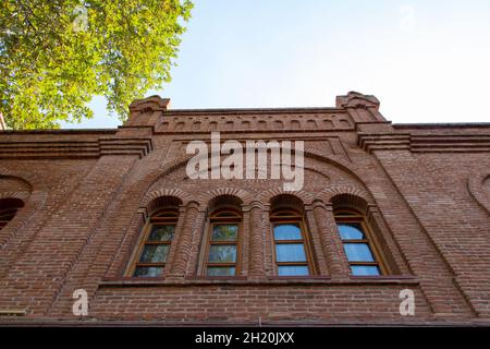 Brick building with windows on sky background. Ugurlu Khan Caravanserai in Ganja city of Azerbaijan Stock Photo