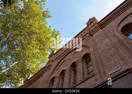 Brick building with windows on sky background. Ugurlu Khan Caravanserai in Ganja city of Azerbaijan Stock Photo