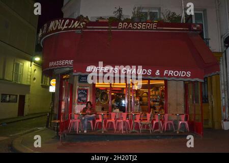 FRANCE, PARIS. 20.02.2012. Very cute, colorful and pink cafe facade in Paris Street during night. Stock Photo