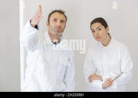 female apprentice decorator in training Stock Photo
