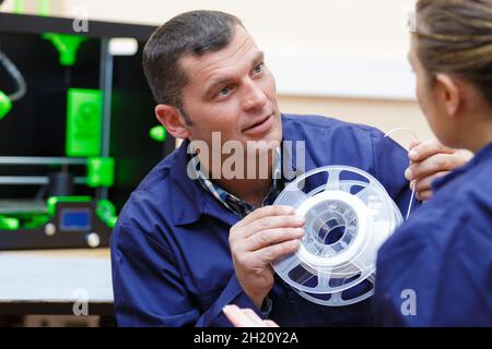 portrait of workers during 3d printer mechanic Stock Photo