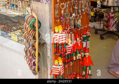 VENICE, ITALY - May 01, 2016: the Wooden toy souvenirs for sale in front of a gift shop in the city center. Stock Photo