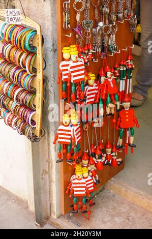 VENICE, ITALY - May 01, 2016: the Wooden toy souvenirs for sale in front of a gift shop in the city center. Stock Photo