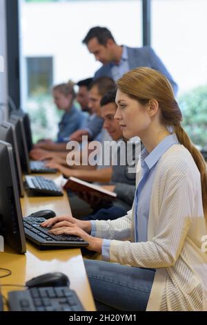 student working on laptop pc in college Stock Photo