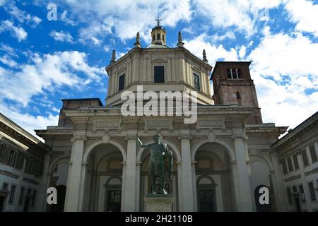Bronze statue of Constantine the Great standing in front of Basilica of San Lorenzo. Stock Photo