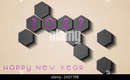 2022 New Year celebration - Modern futuristic abstract background made with gray hexagons - Colored numbers in relief Stock Photo