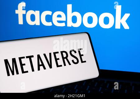 FACEBOOK META Metaverse concept. Smartphone silhouette with METAVERSE word and company logo on the blurred background. Not a montage. Stock Photo