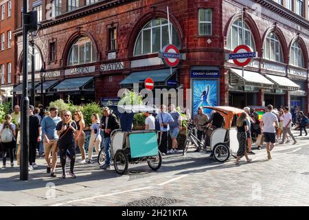 Rickshaw or pedicab drivers waiting for tourists at Covent Garden in London, England United Kingdom UK Stock Photo