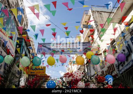 Nablus, Palestine. 19th Oct, 2021. View of a decorated street with balloons on the occasion of the birth of the Prophet Muhammad. Palestinians decorate the streets of the old city of Nablus on the occasion of the Prophet's birthday. Muslims celebrate the Prophet's birthday every year on the twelfth of Rabi' al-Awwal, the third month of the Islamic calendar. Credit: SOPA Images Limited/Alamy Live News Stock Photo