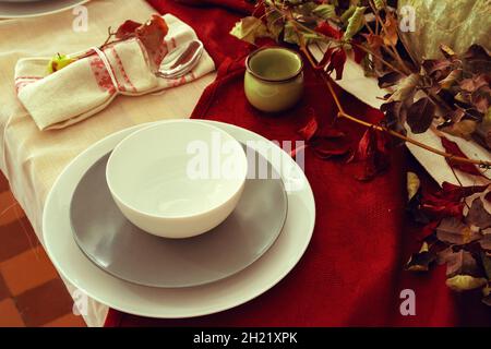 Stylish thanksgiving autumn table decor with pumpkin and dried branches Stock Photo
