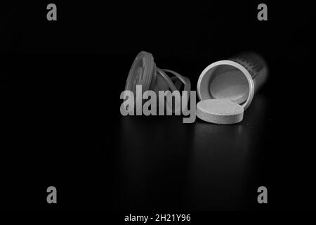 Selective focus shot of multivitamins effervescent tablets isolated on black background Stock Photo